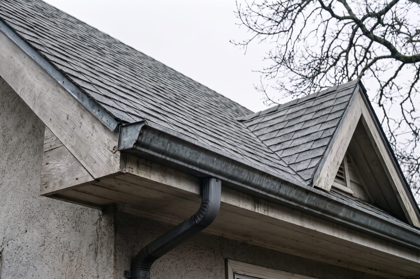 The same roofline cleared of moss and debris.